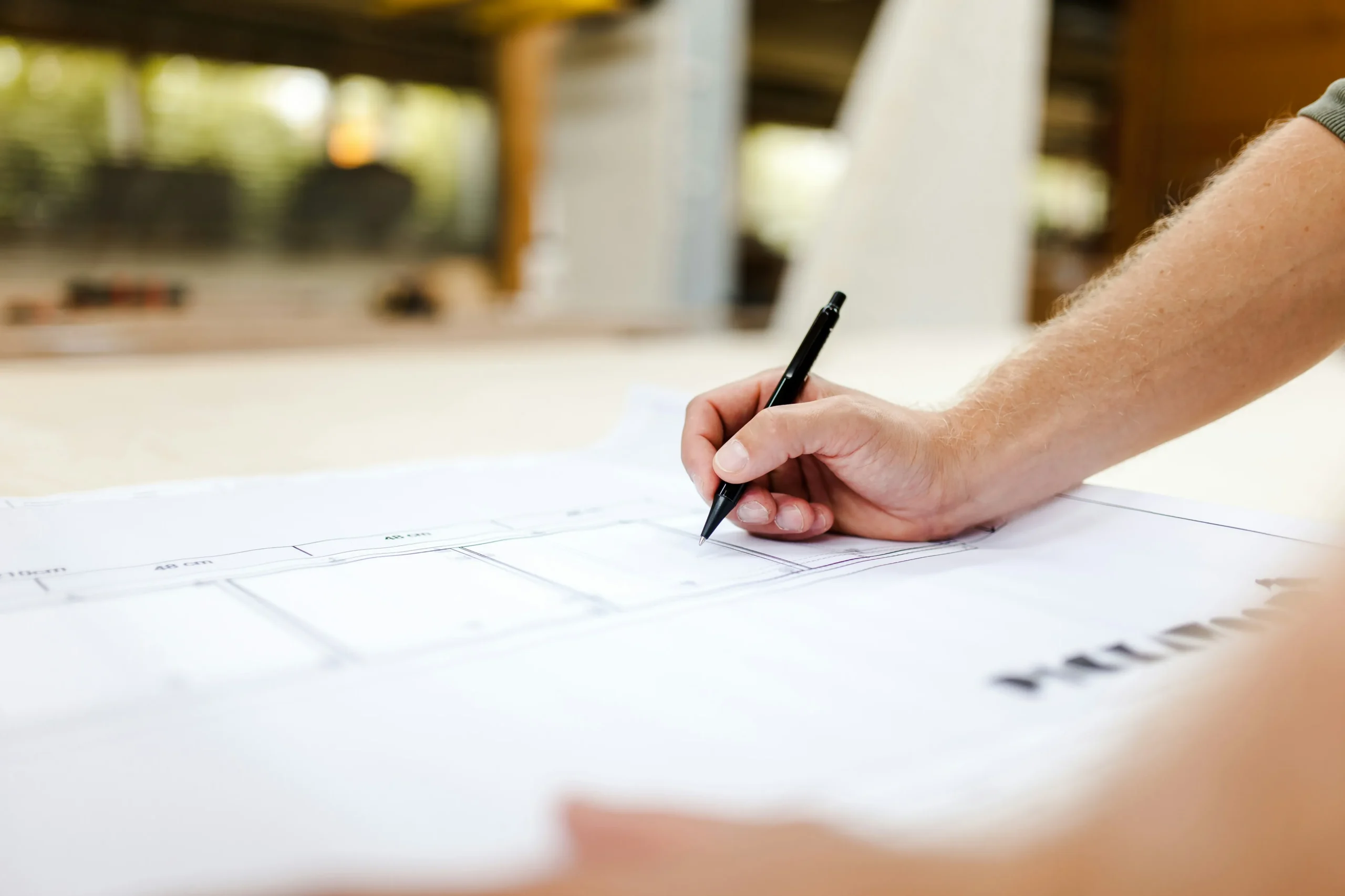 Engineers reviewing gas system design drawings during consultancy