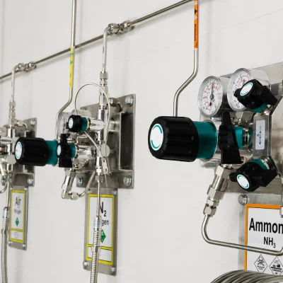 Wall-mounted ammonia and nitrogen gas supply panels with pressure regulators