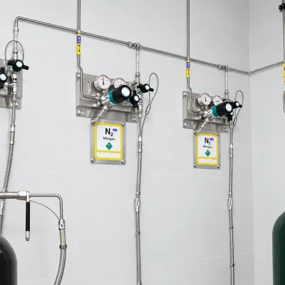 Wall-mounted air, nitrogen and argon gas supply panels with cylinders