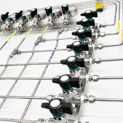 Laboratory valve control assemblies connected to stainless-steel distribution tubing