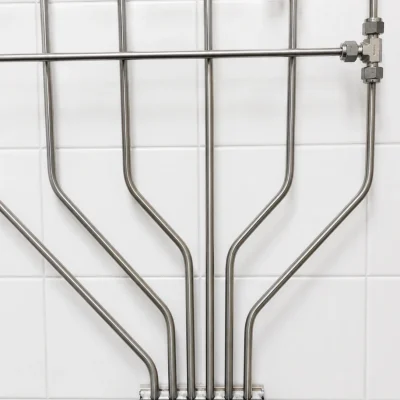 Precisely routed stainless-steel tubing for a central gas distribution system