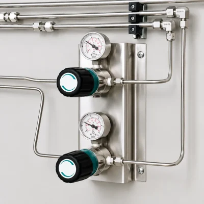 Two-stage line pressure regulators installed in a petrochemical laboratory
